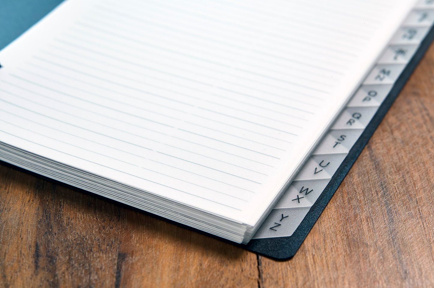 Telephone book, DIN A5, PP, with spiral binding, with embossing, 12-part index, black